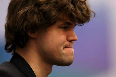 Magnus Carlsen in deep thought during a chess match.