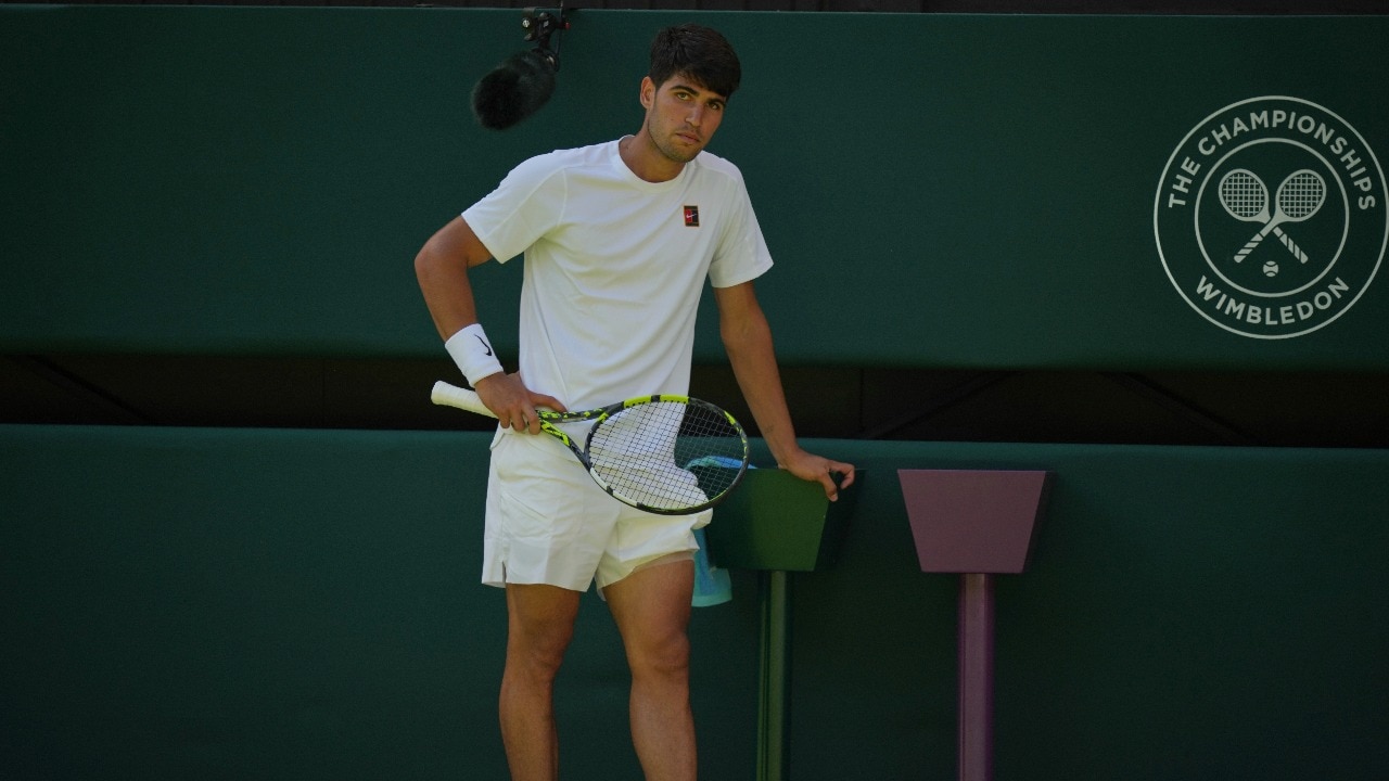 Alcaraz battles through first round at Wimbledon